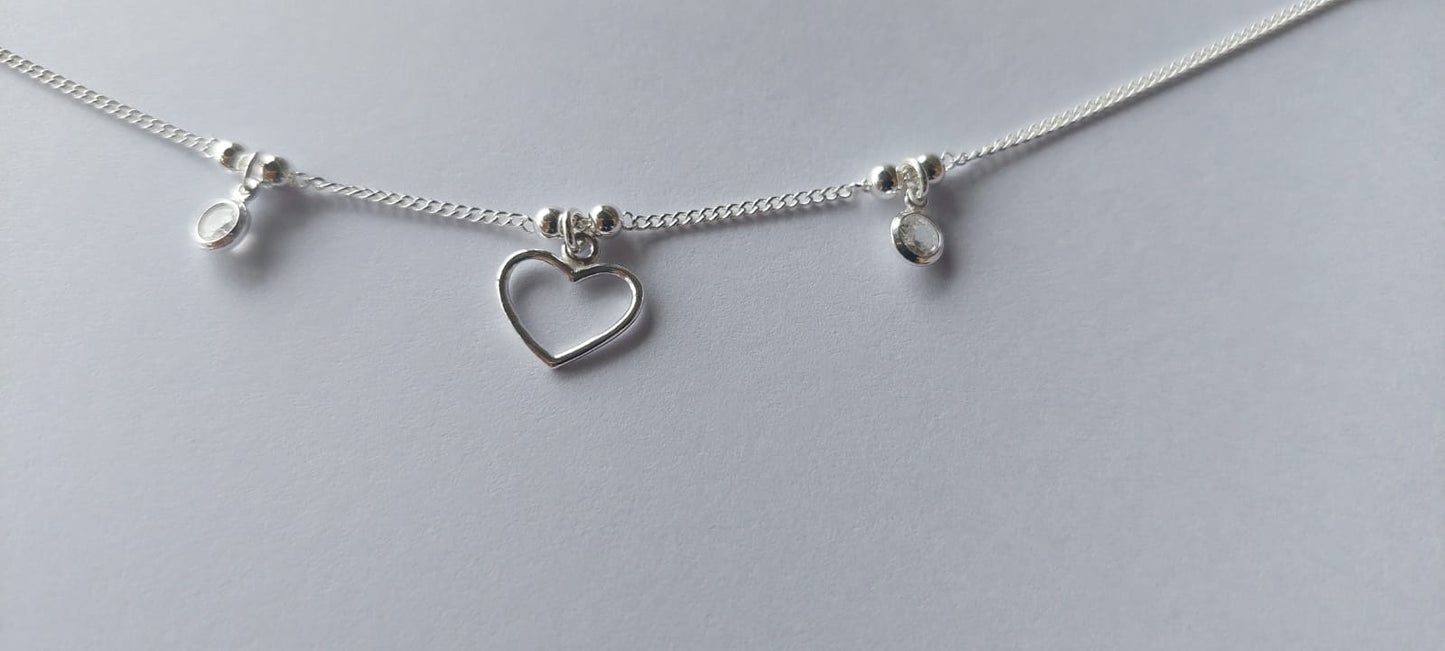 Pulsera grumet con corazón y puntos de luz