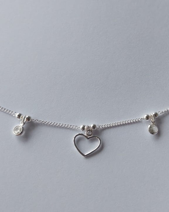Pulsera grumet con corazón y puntos de luz