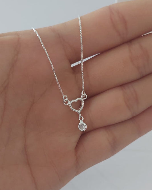 Cadena con corazón y punto de luz